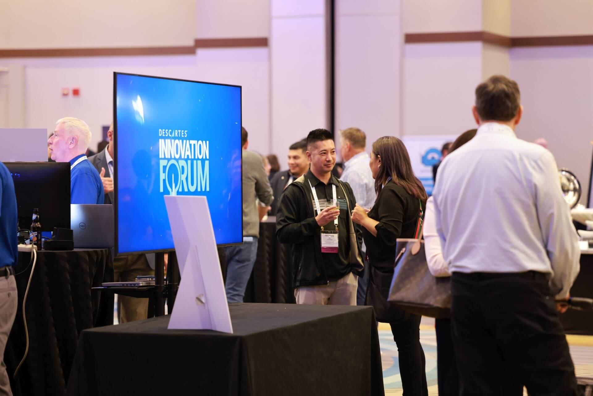monitor with Descartes Innovation Forum and customers interacting